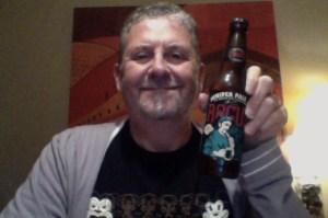 Unshaved man and a beer