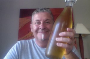 Man about to find the sun has a beer he's waving